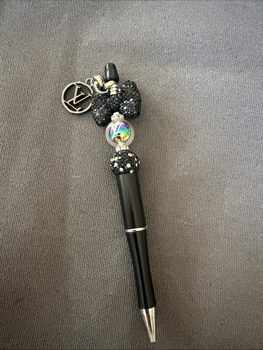 Handcrafted pen with stylish charm